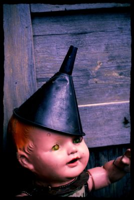 creepy-doll-with-metal-funnel